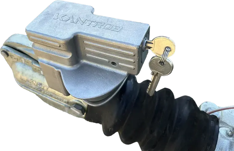 Kantrob hitch lock fitted to a Knott coupling on a trailer, keys in the barrel